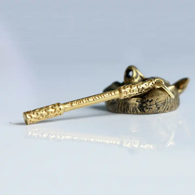 Gaming collectible metal keychain replica of legendary staff from Black Myth Wukong with vintage metallic finish.