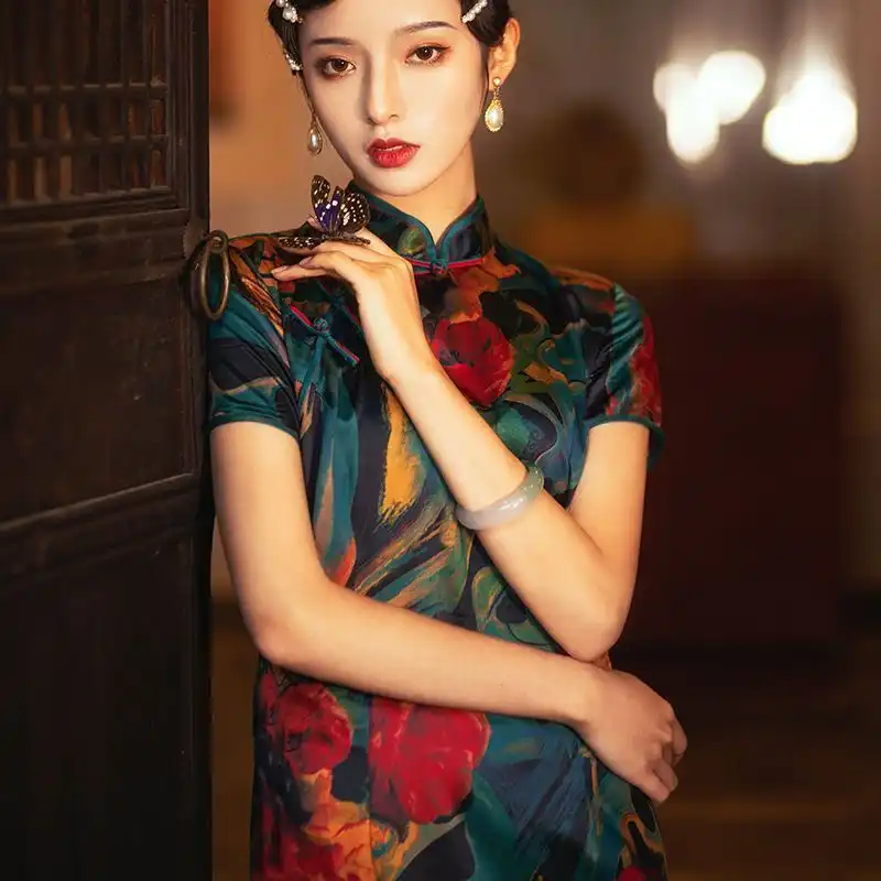 Model in high slit cheongsam for formal occasion showing sophisticated urban elegance.