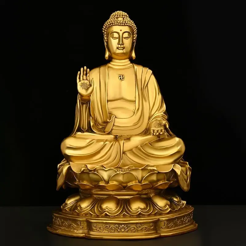 Buddha statue in meditation room with yoga mat and cushions creating zen atmosphere.