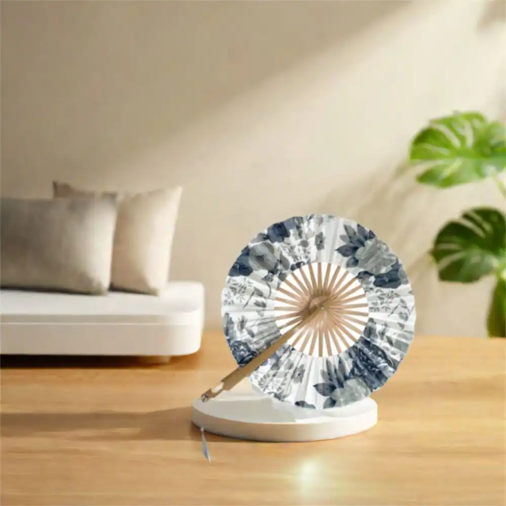 Gift presentation of round bamboo fan in packaging suitable for special occasions and cultural celebrations.