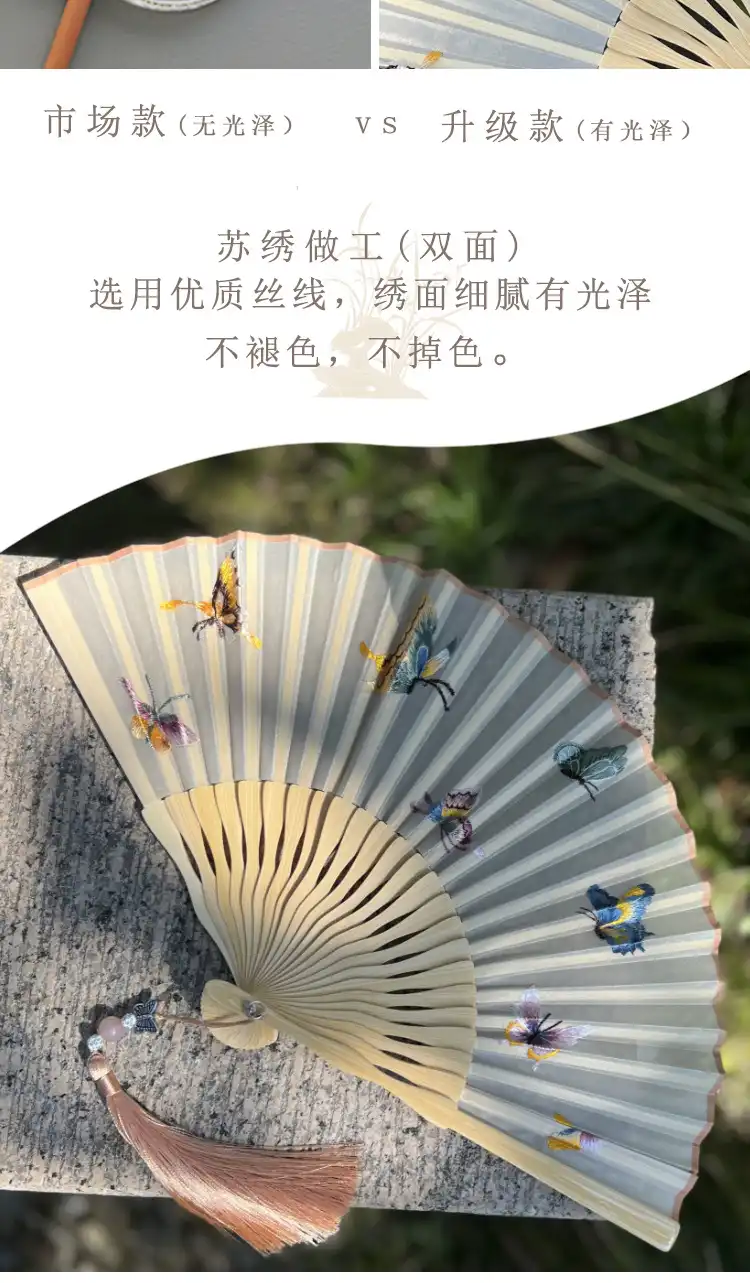 Traditional style folding fan with tassel arranged as gift presentation on elegant background.