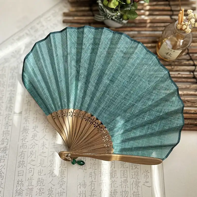 Multiple solid color options of Japanese shell fans arranged showing available style variations.