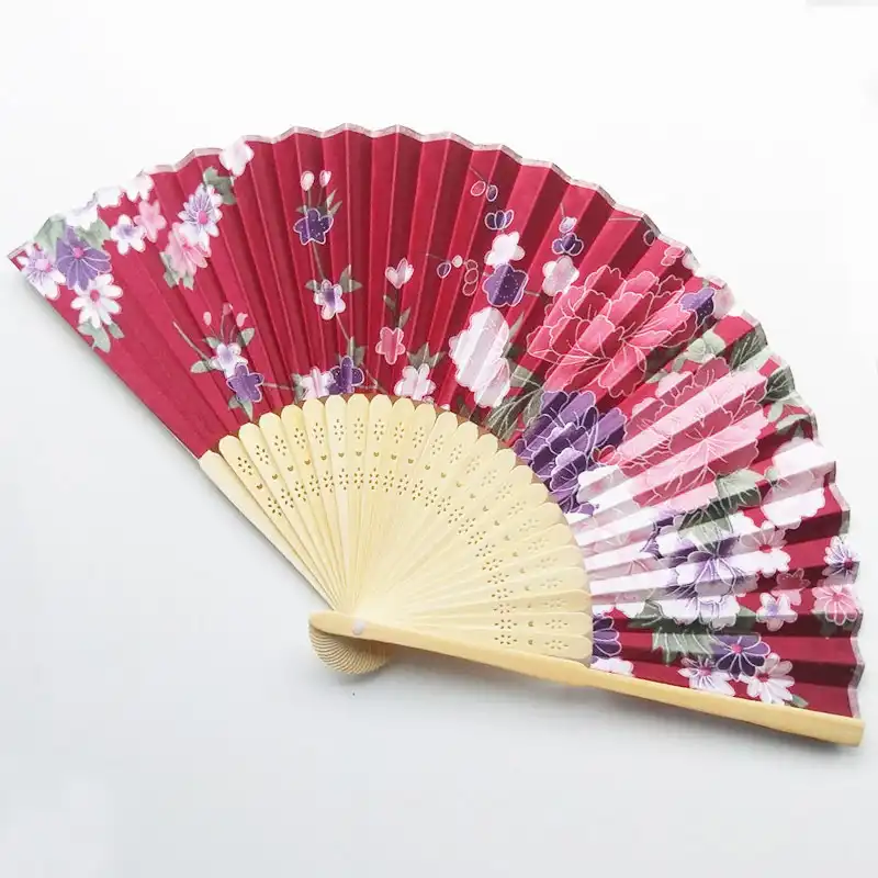 Wedding party setting featuring silk fans as decorative elements and ceremonial accessories.