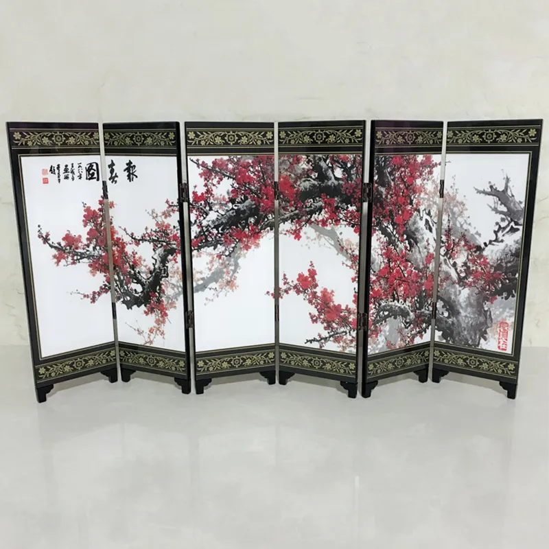 Wooden folding mechanism detail showing hinge connection between spring decorated screen panels.