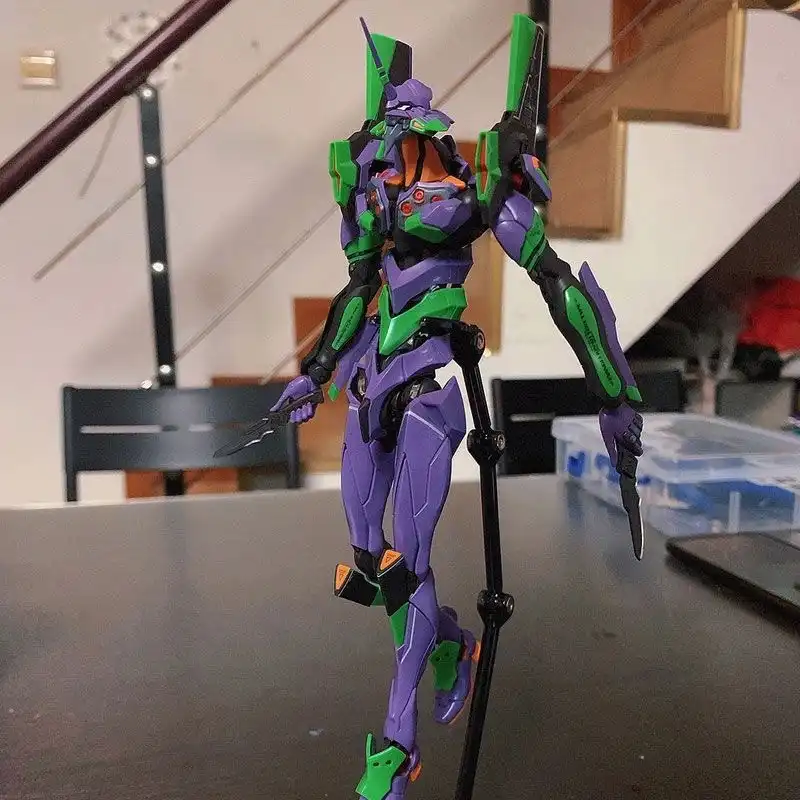 Evangelion 01 1:144 model kit, assembled on desk with box..