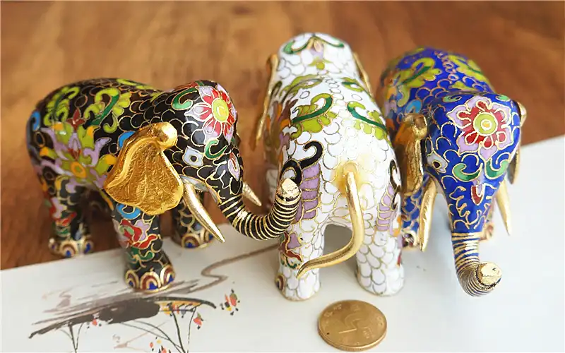 Elephant trunk detail showing traditional cloisonne enamel application and wire borders.