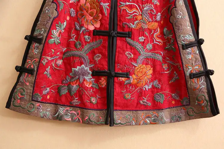 Side profile view showing elegant sleeveless design and vintage vest silhouette.