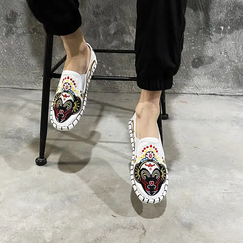 Casual street style photo featuring embroidered canvas loafers with modern fashion outfit.