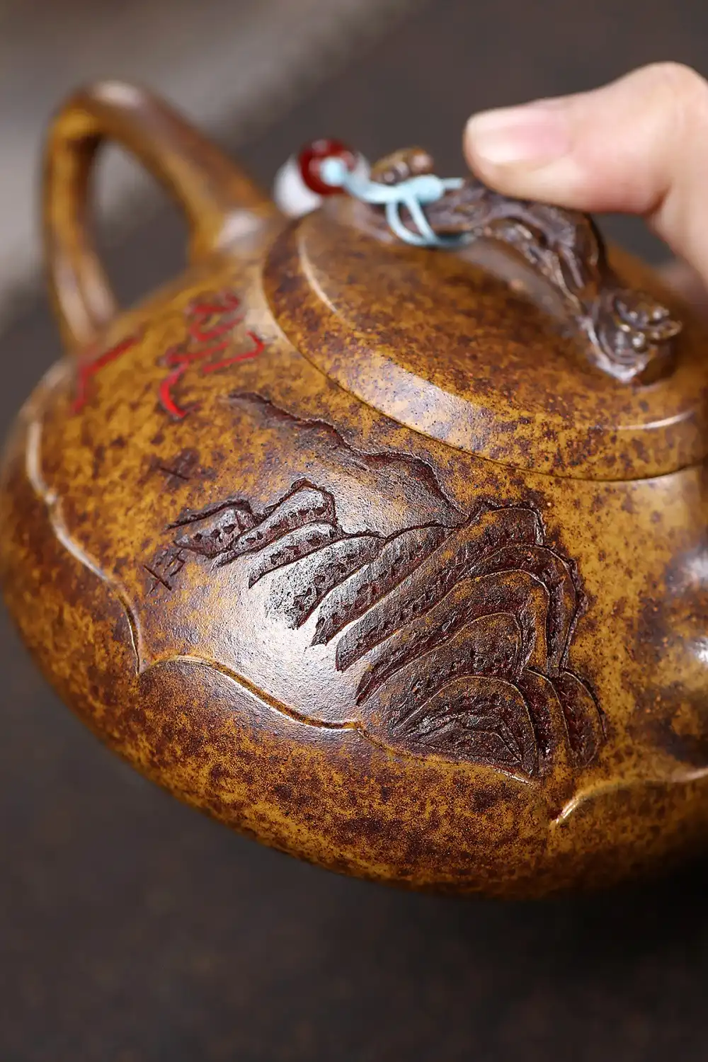 Raw ore keel gold sand stone ladle teapot 330ml with seven-hole water outlet and tiger mountain view.