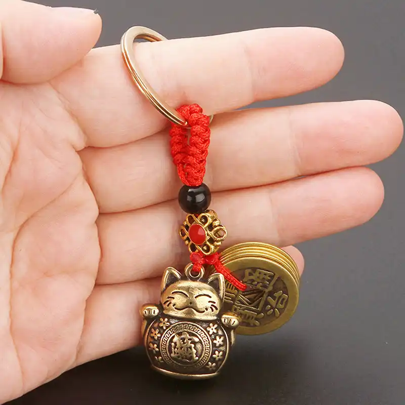 Gift presentation of chinese lucky coin keychain in attractive packaging.