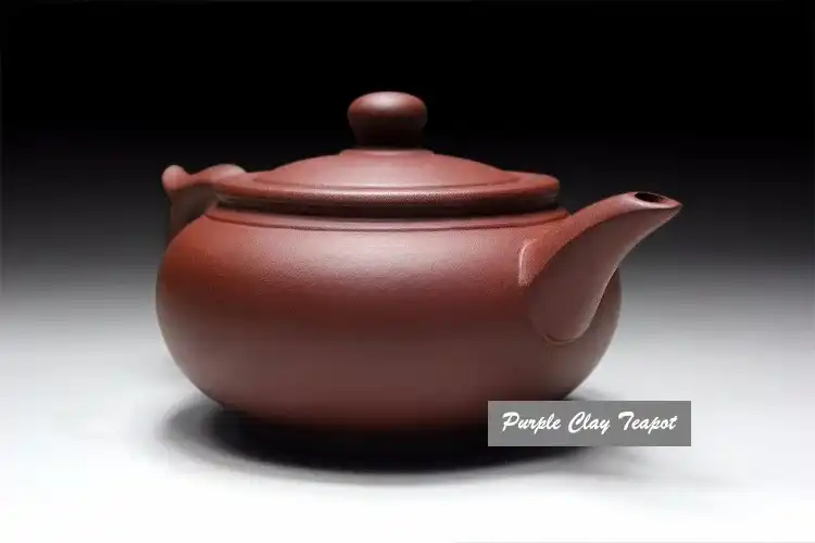 Purple clay teapot dimensions 17.5cm x 8.5cm demonstrating comfortable size and ergonomic design.
