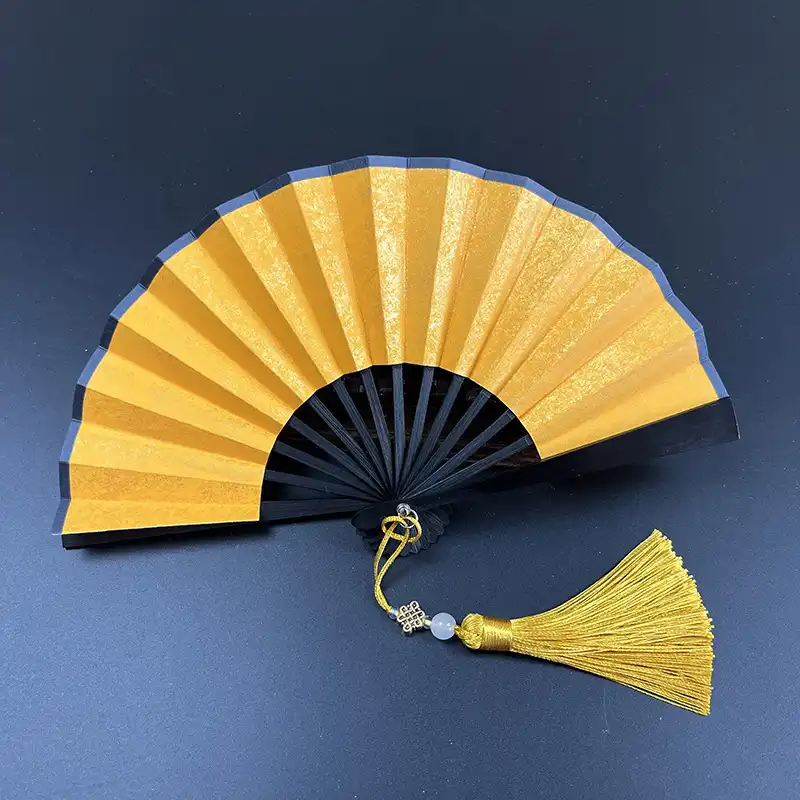 Blank paper surface of folding fan perfect for DIY customization and artistic decoration projects.