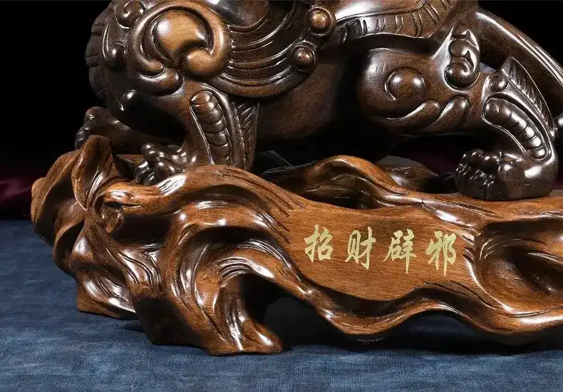 Traditional Chinese Pixiu figure demonstrating size proportions next to common household items for scale.