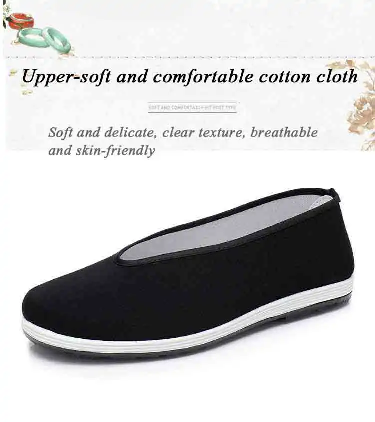 Classic black kung fu shoes on traditional Chinese fabric background showcasing cultural heritage.
