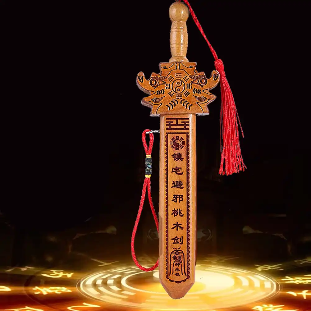Hand holding lightweight 43g peach wood sword showing natural wood grain and polished finish.